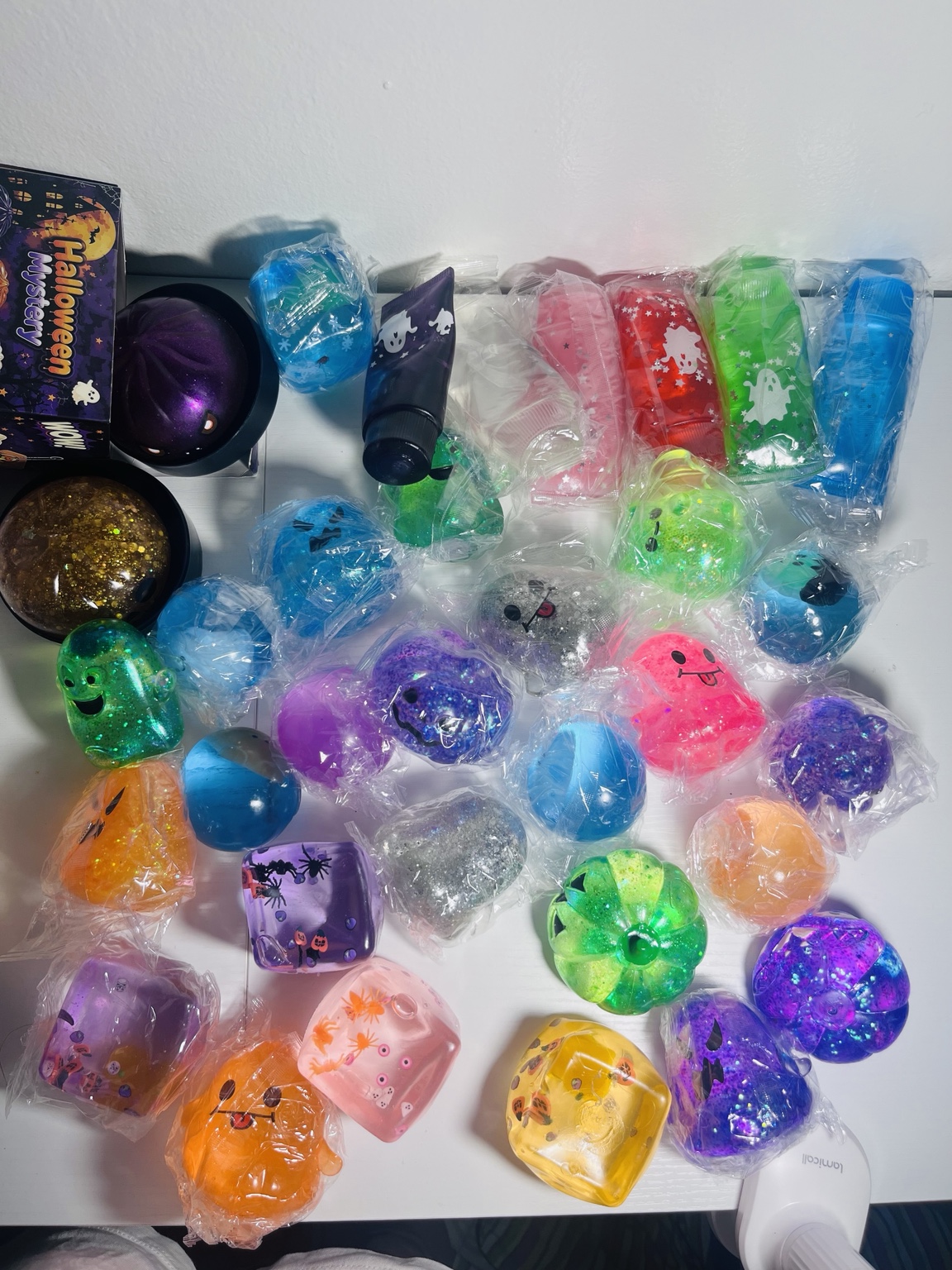 Assorted Halloween Maltose Squishies in colorful ghost, pumpkin, ball, bar, and cube designs
